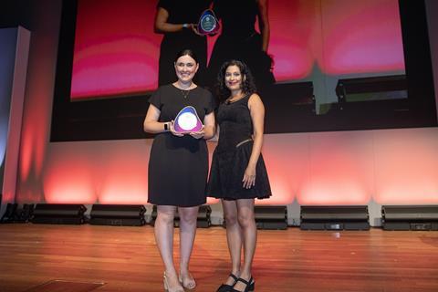 Jo Fahy accepts the award from Nadira Tudor